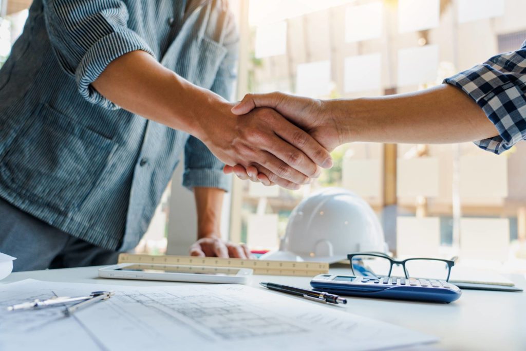 contractor and client shaking hands